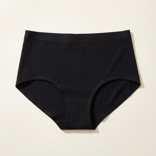 High-waisted smoothing support brief in Black, laid flat