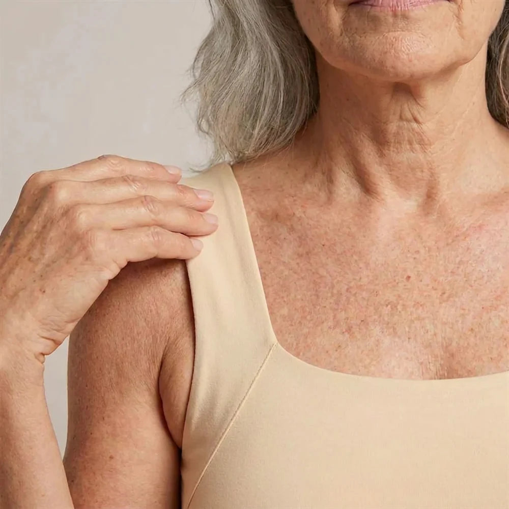 Wide, soft strap sitting flat on the shoulder